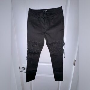 Fashion Nova, black denim, with lace up detail on thigh area. Size 11.